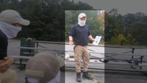 An image of Cerce speaking to other Patriot Front members in a Hopedale MA park during October 2021. Cerce, in his Patriot Front garb, holds some propaganda flyer as he orates.