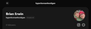 A screenshot of the header to a Threads account. The handle is "Hyperborean Hooligan," with the name down as "Brian Erwin." The profile photo is of Irwin and his girlfriend, whose face has been intentionally redacted, dressed in cold-weather clothes. 