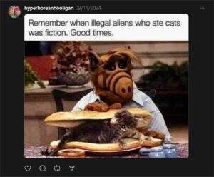 A screen shot of a post on Threads, by Irwin as "Hyperborean Hooligan," dated September 11th, 2024. It is a basic text-and-photo meme. The text above reads "Remember when illegal aliens who ate cats was fiction. Good times." The image is of the sci-fit sitcom character Alf, with a cat in between two halves of a French loaf.