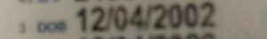 A photo of Colwell's ID, cropped to his birthdate. It reads December 4th, 2002.