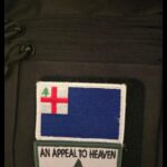 A screenshot of a Twitter post by Colwell via his Pray2Himmler account, dated February 23rd, 2025. The post states "New Bag," and includes a photo of the back panel of a generic black backpack. The panel has two patches attached to it: one a St. George's Cross version of the New England independence flag in blue, and the other an Appeal to Heaven flag.