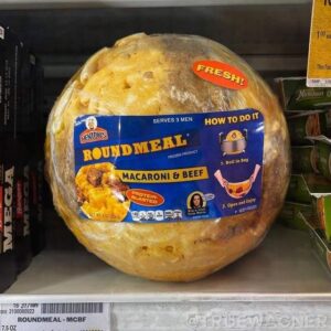 The profile photo Colwell used for his Curiouscat account. It is a photo of a Henton's macaroni & beef "round meal," a sphere of food in a vacuum-sealed bag one is supposed to boil before opening and serving to, apparently, three men.